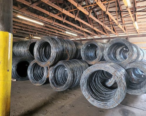 Steel Wire Coils are stored at an indoor warehouse