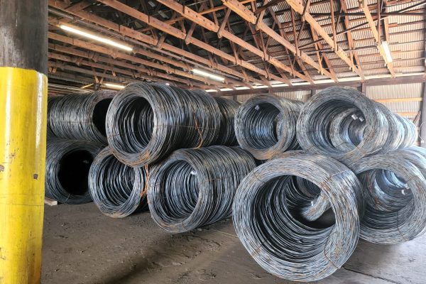 Steel Wire Coils are stored at an indoor warehouse